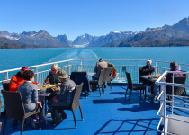 Enjoying lunch as we sail through Greenland fjord
