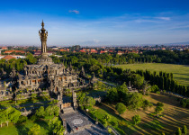 Aerial view taken by drone of the Bajra Sandhi famous monument in Renon area and surrounded with trees and gardens in central Denpasar in Bali.