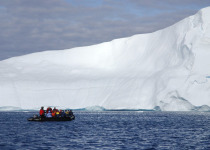zodiac beside iceberg
