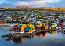 Sunrise scene of capital city Torshavn in Faroe Islands in North Atlantic. Urban scene of scandinavian city in warm golden sunlight.